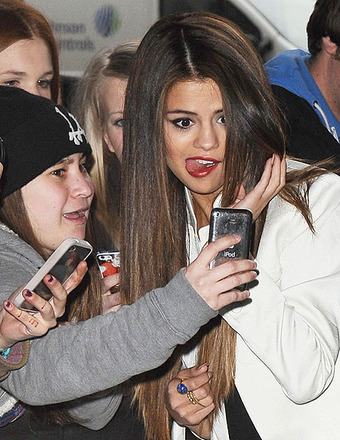 Selena Gomez posed for pictures with fans outside the BBC Radio 1 Studios.
