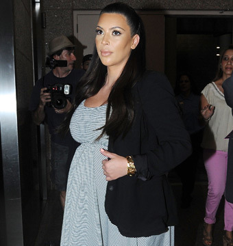 Pregnant Kim Kardashian Threatened by Paparazzi, Lashes Out