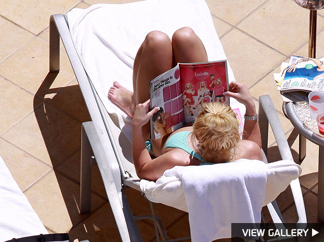 Bauer-Griffin Britney relaxes by the pool