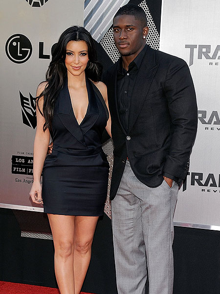 Getty Images kim kardashian and reggie bush