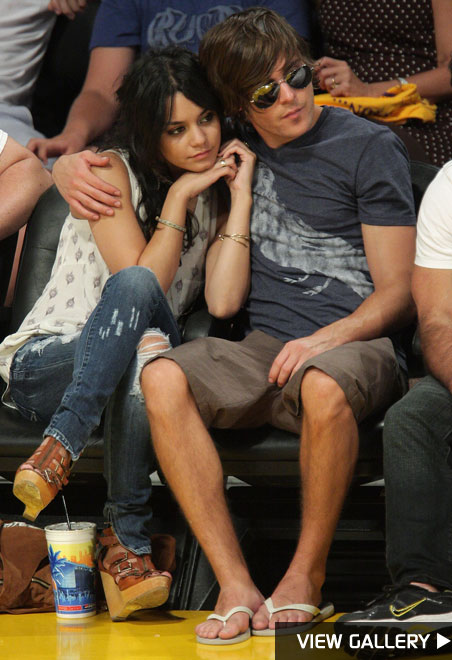 Getty Images zac efron and vanessa hudgens cuddling lakers game