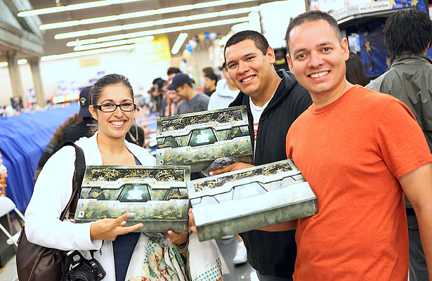 A trio of happy fans show off their autographed copies of StarCraft II: Wings of Liberty, Blizzard Entertainment's newest computer game. Blizzard developers were on hand to sign game boxes at a midnight launch celebration in Orange County, CA. star-craft3.jpg